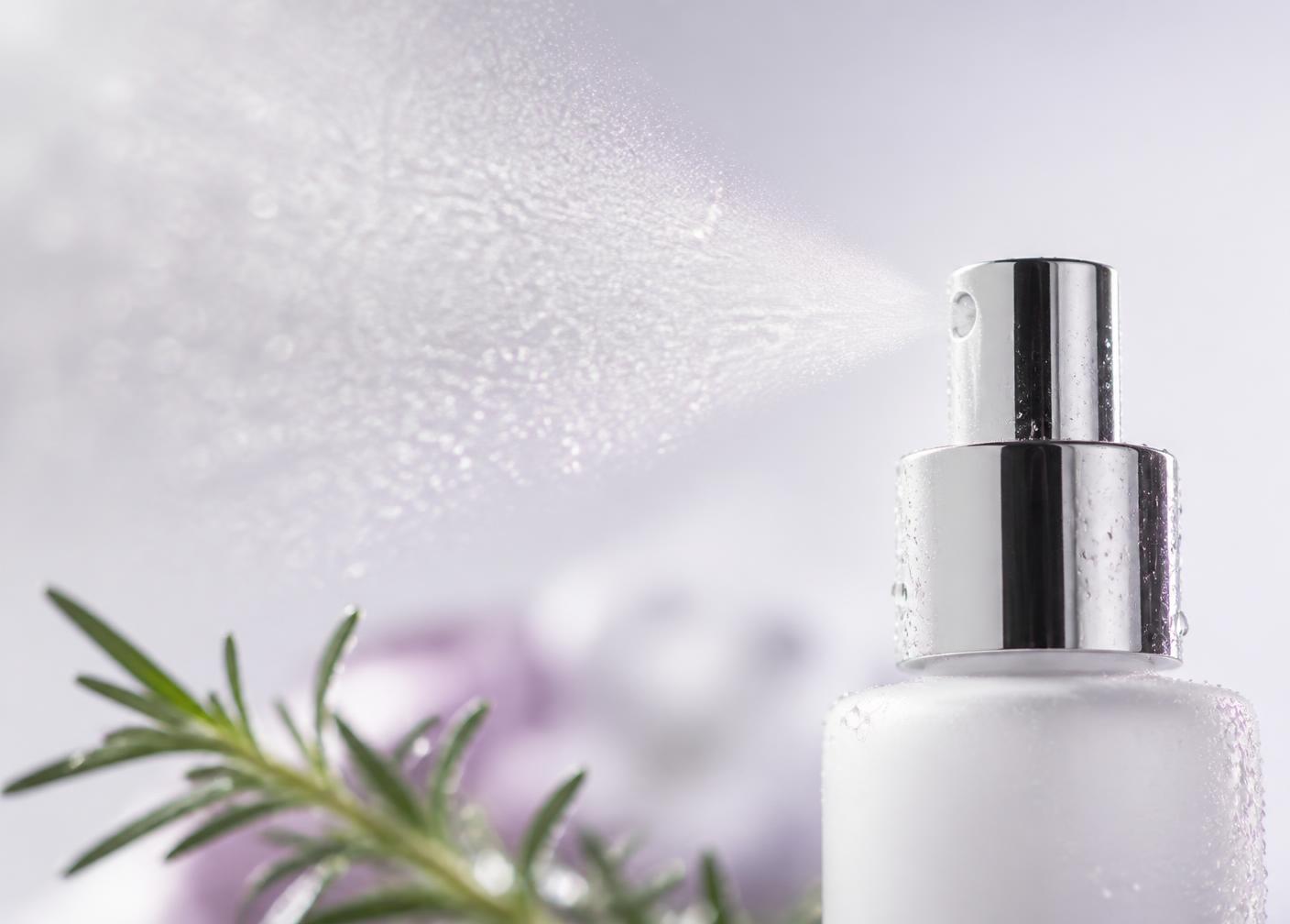 Close-up of the fine Rosemary Mist spray with a rosemary sprig